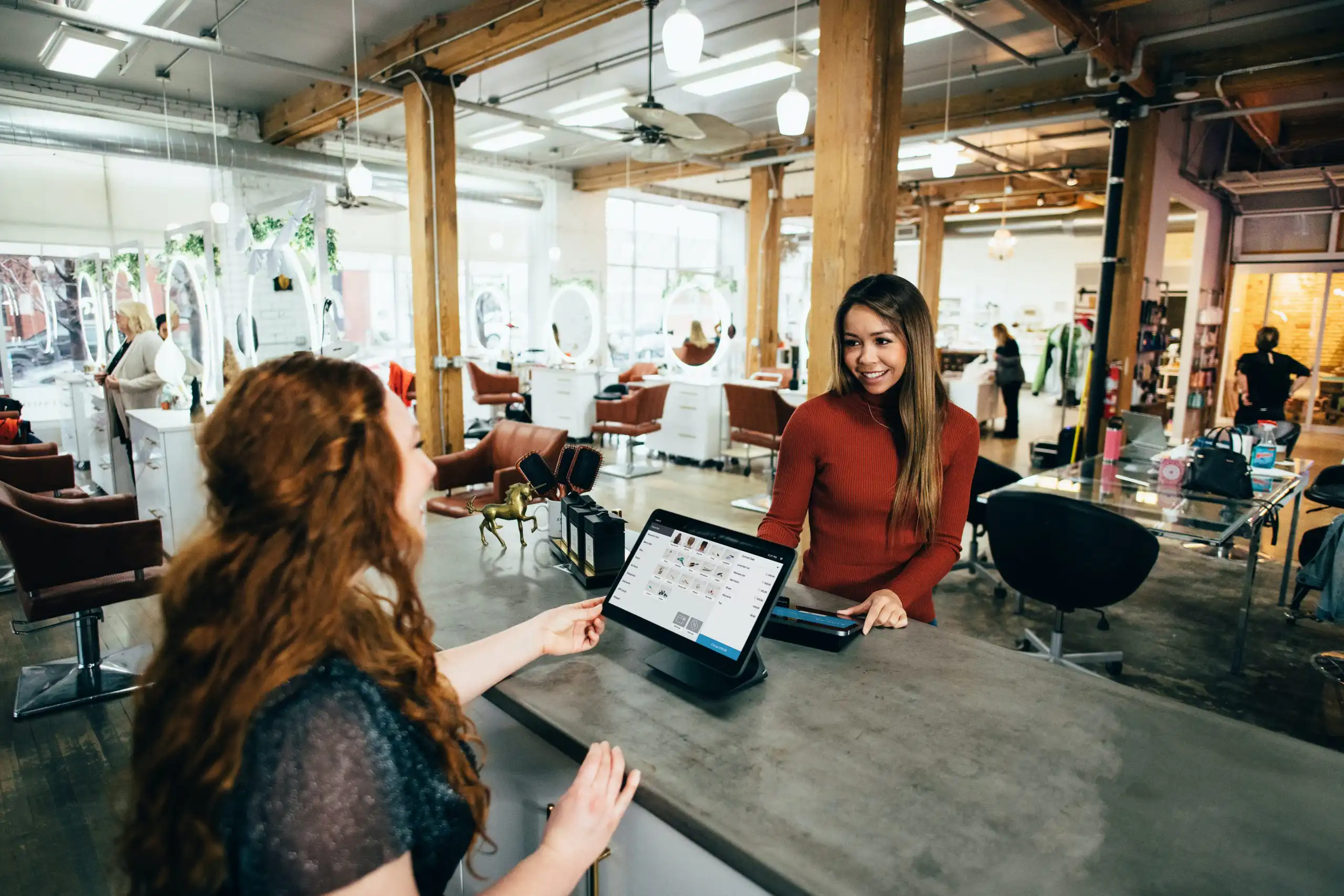 Two women working on laptops