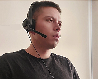Closeup photo of an ETTE technician with a headset on